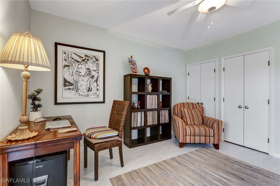 1910 Virginia Avenue, Unit 403 Fort Myers, FL 33901 - Photo 23 of 45 a living room with furniture and a baby crib