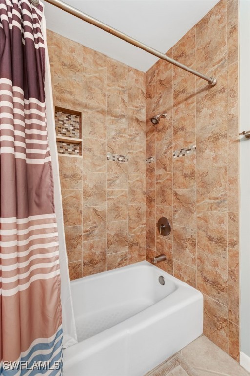 1910 Virginia Avenue, Unit 403 Fort Myers, FL 33901 - Photo 26 of 45 a bathroom with a bathtub