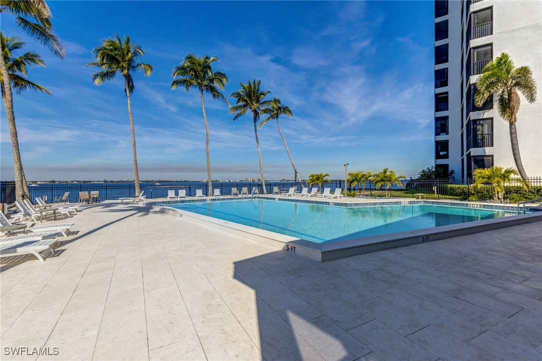 1910 Virginia Avenue, Unit 403 Fort Myers, FL 33901 - Photo 34 of 45 a view of a swimming pool with a yard