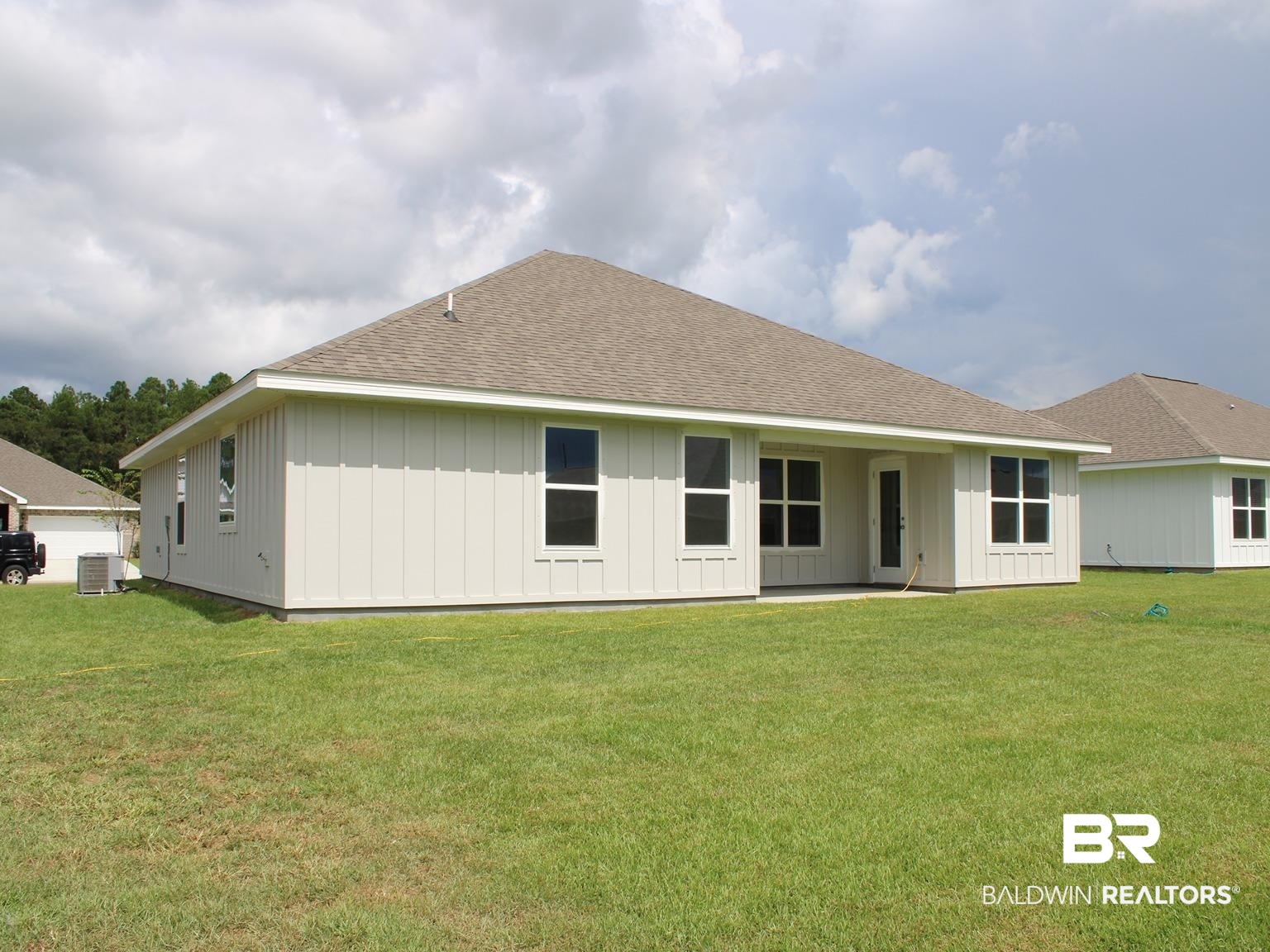 24385 Ringneck Loop Elberta, AL 36530 - Photo 33 of 33 Back of property featuring central air condition unit and a yard