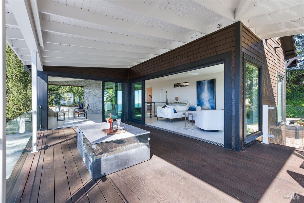 3100 Muniz Ranch Road Jenner, CA 95450 - Photo 27 of 62 Sunroom and Living Area open to expansive decking.