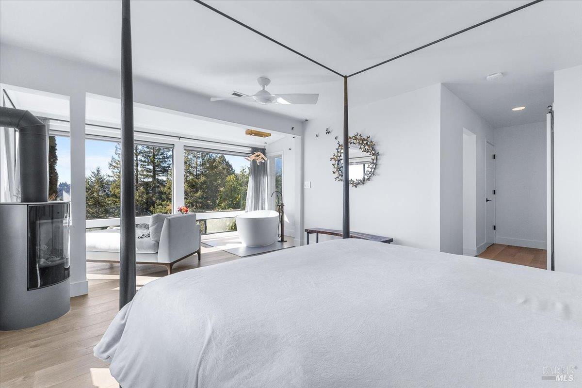 3100 Muniz Ranch Road Jenner, CA 95450 - Photo 32 of 62 a large white bed in a large bedroom next to a window