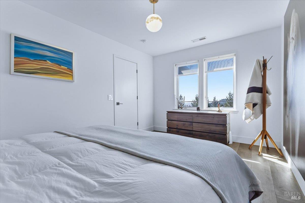 3100 Muniz Ranch Road Jenner, CA 95450 - Photo 42 of 62 a bedroom with a bed and a dresser