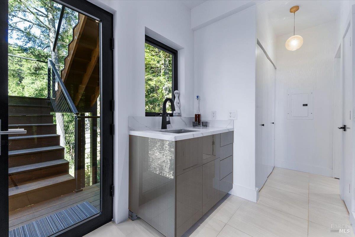 3100 Muniz Ranch Road Jenner, CA 95450 - Photo 8 of 83 Entrance to main level from the garage. Hallway to Bath #1. Washer & Dryer - Electrolux. Custome Stair Railings.