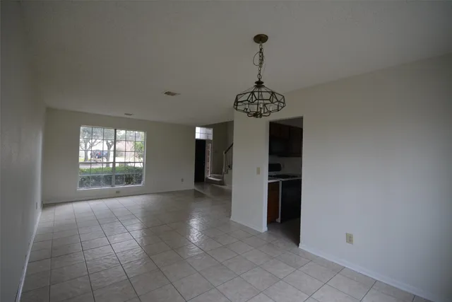 a view of a hallway with a chandelier