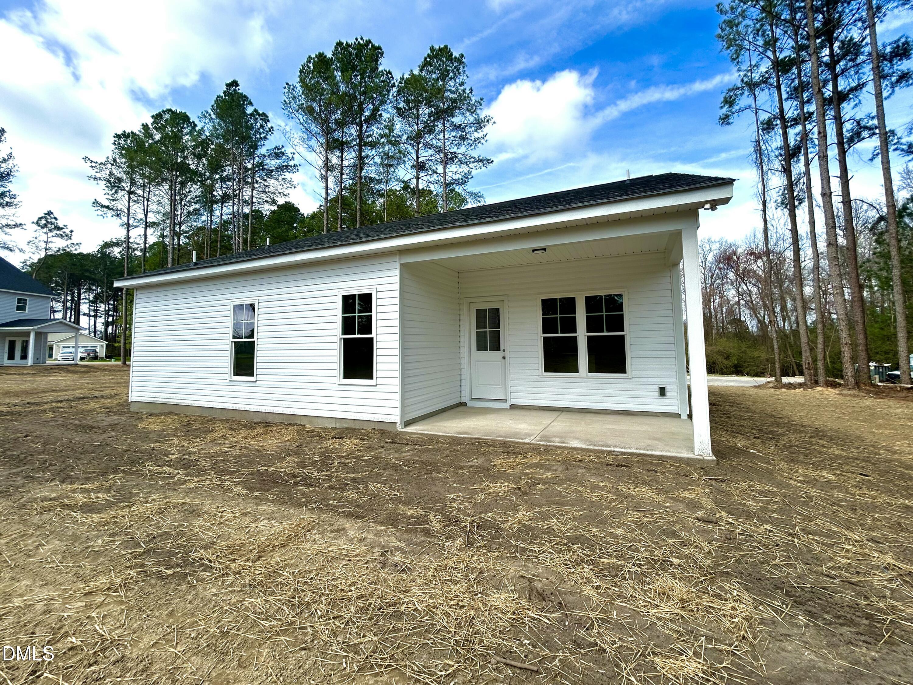 1725 Cardinal Drive Deep Run, NC 28525 - Photo 20 of 21 a house with trees in the background