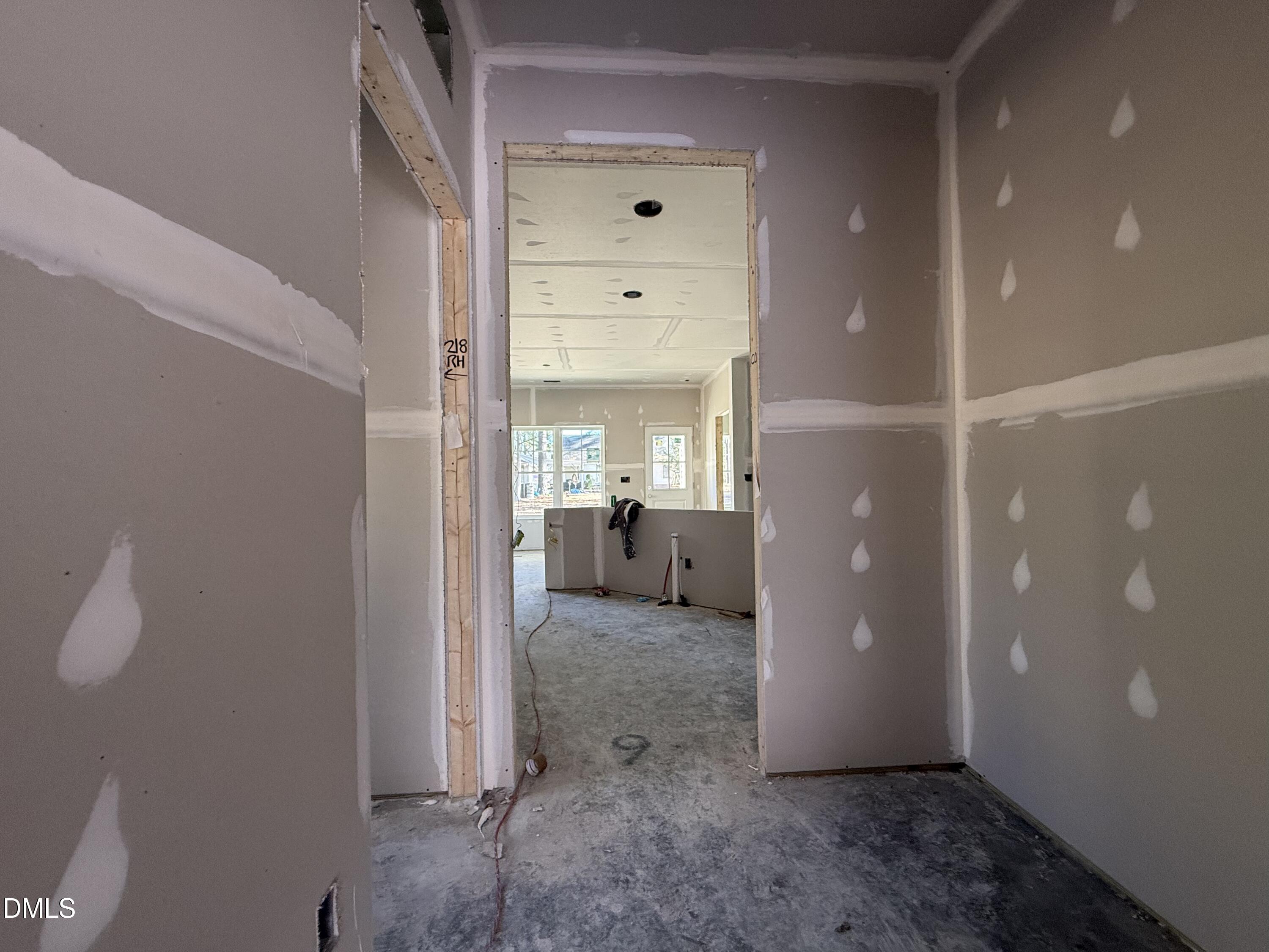 1725 Cardinal Drive Deep Run, NC 28525 - Photo 5 of 20 a view of a hallway with a room and a bathroom