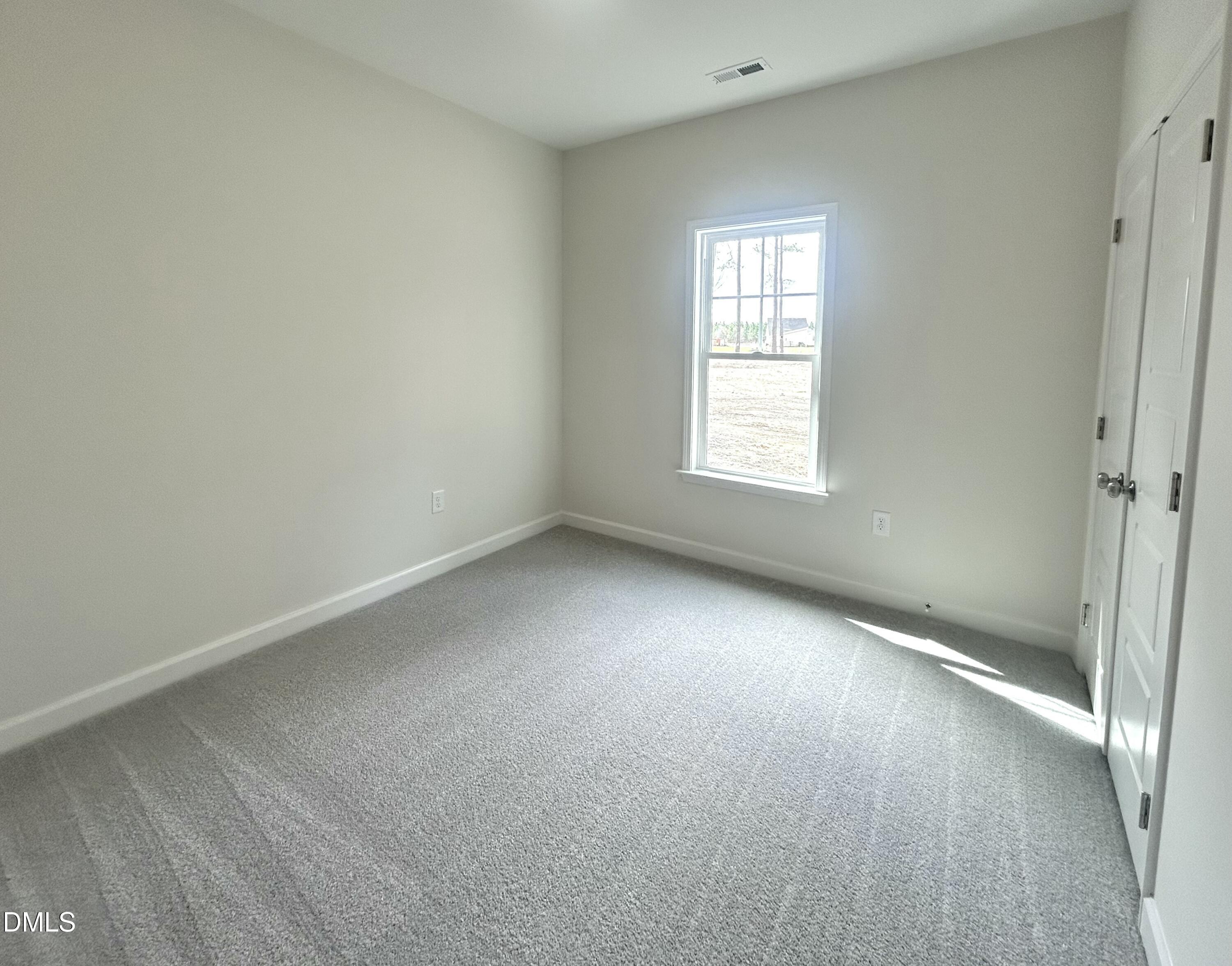 1725 Cardinal Drive Deep Run, NC 28525 - Photo 9 of 21 a view of an empty room with a window