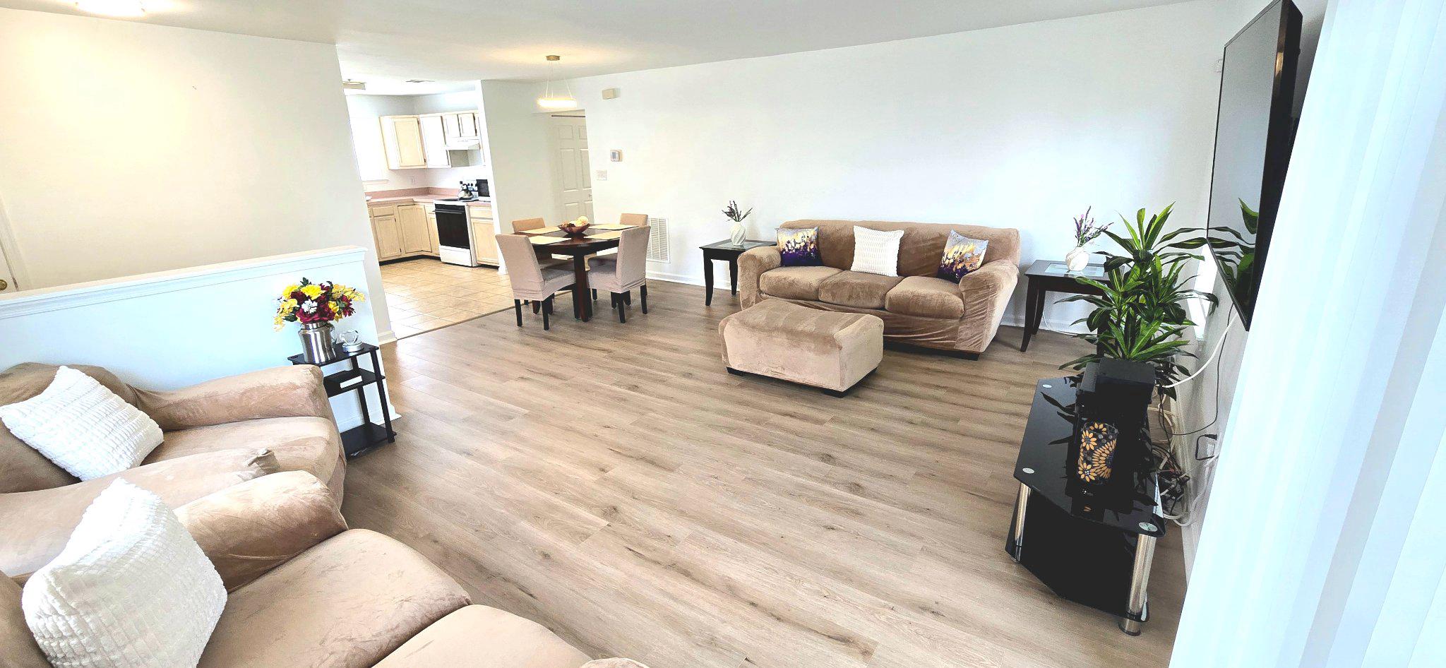 4218 Applegate Lane, Unit 9 Suitland, MD 20746 - Photo 1 of 35 a living room with furniture and wooden floor