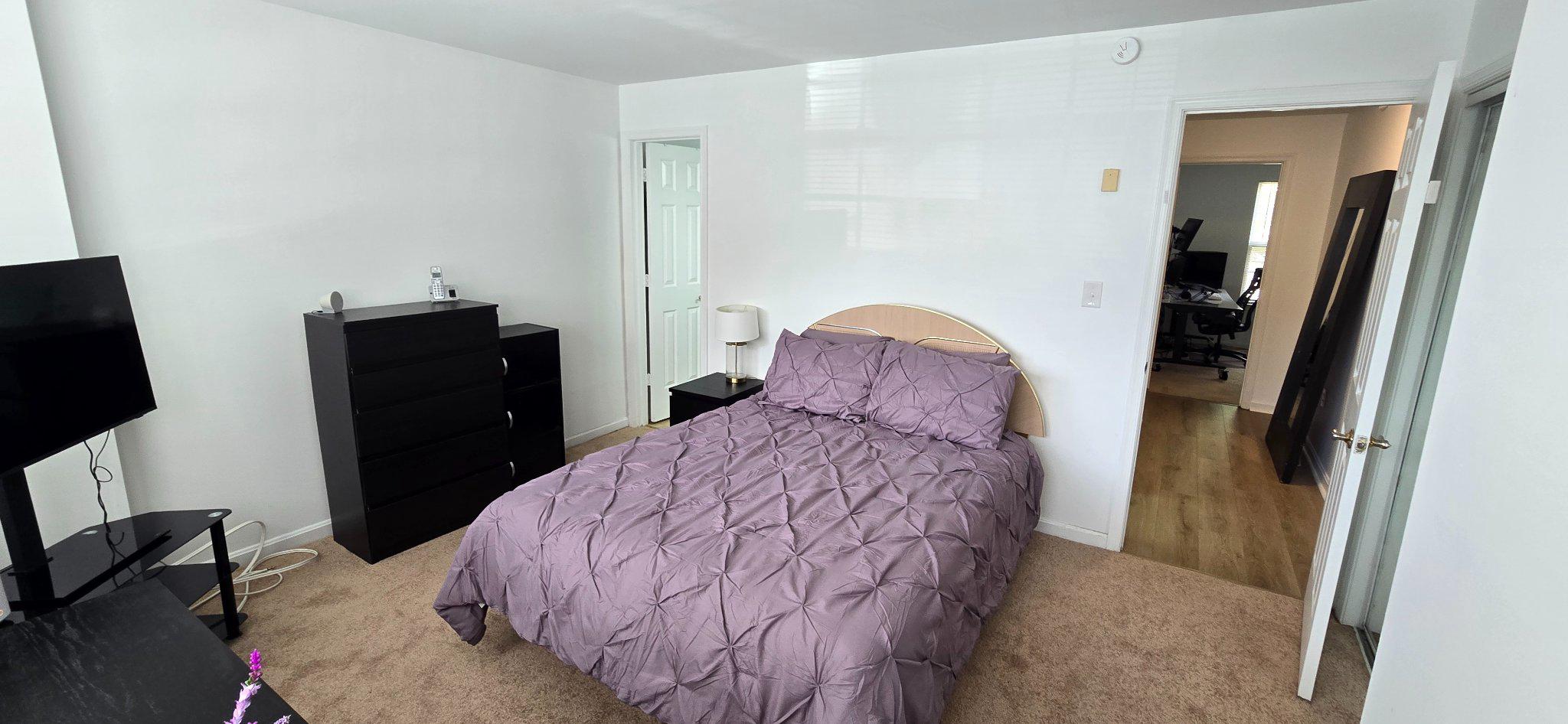 4218 Applegate Lane, Unit 9 Suitland, MD 20746 - Photo 11 of 35 a bedroom with a bed and a flat tv screen on the dresser