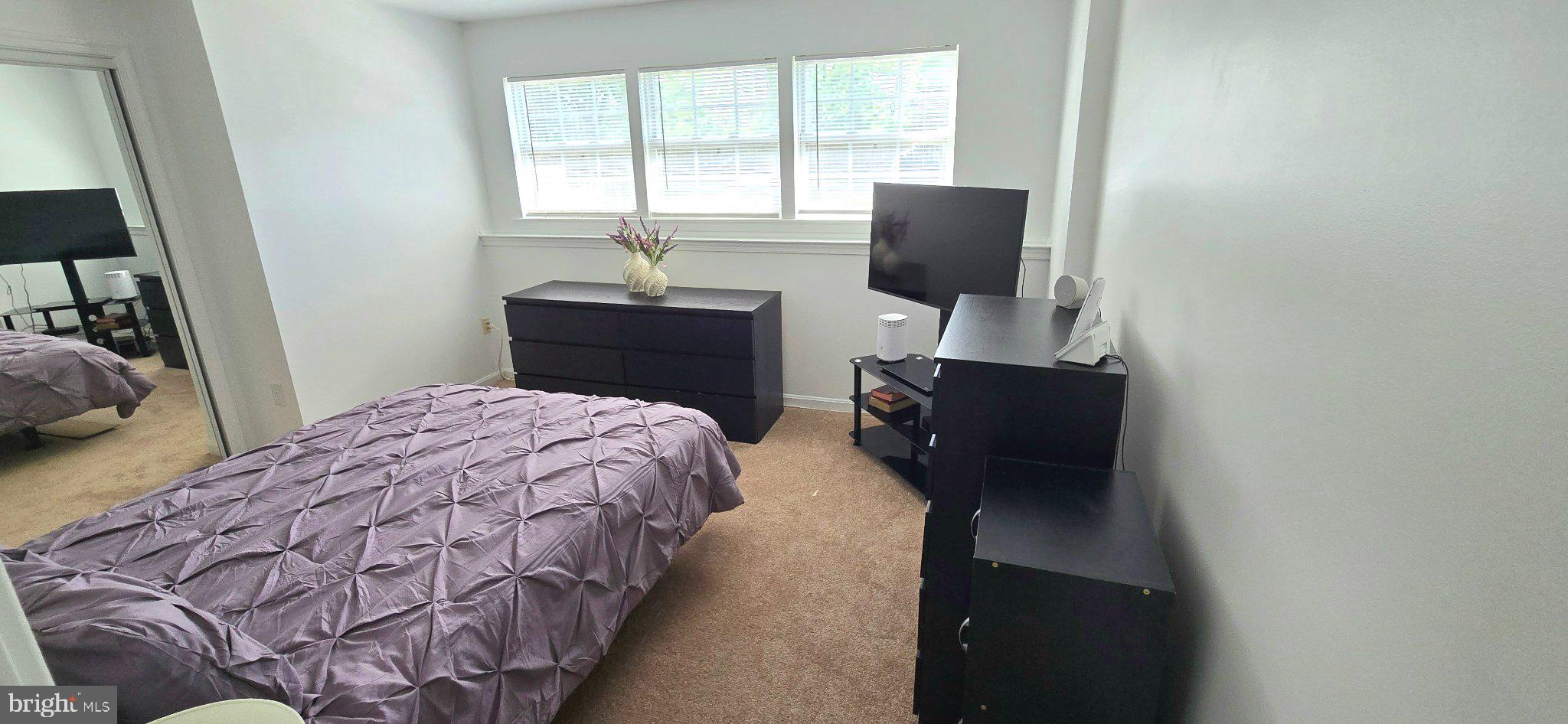 4218 Applegate Lane, Unit 9 Suitland, MD 20746 - Photo 14 of 35 a bedroom with a bed and window