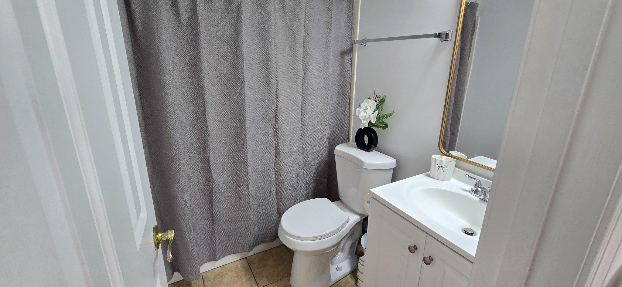 4218 Applegate Lane, Unit 9 Suitland, MD 20746 - Photo 16 of 35 a white toilet sitting next to a white sink