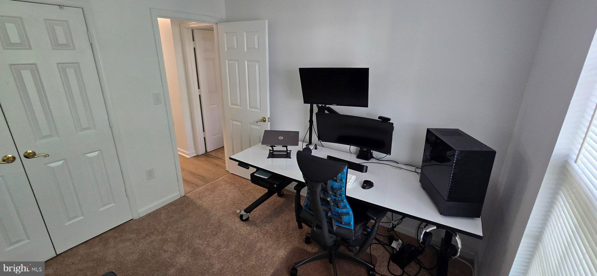 4218 Applegate Lane, Unit 9 Suitland, MD 20746 - Photo 22 of 35 a view of a workspace with furniture and wooden floor