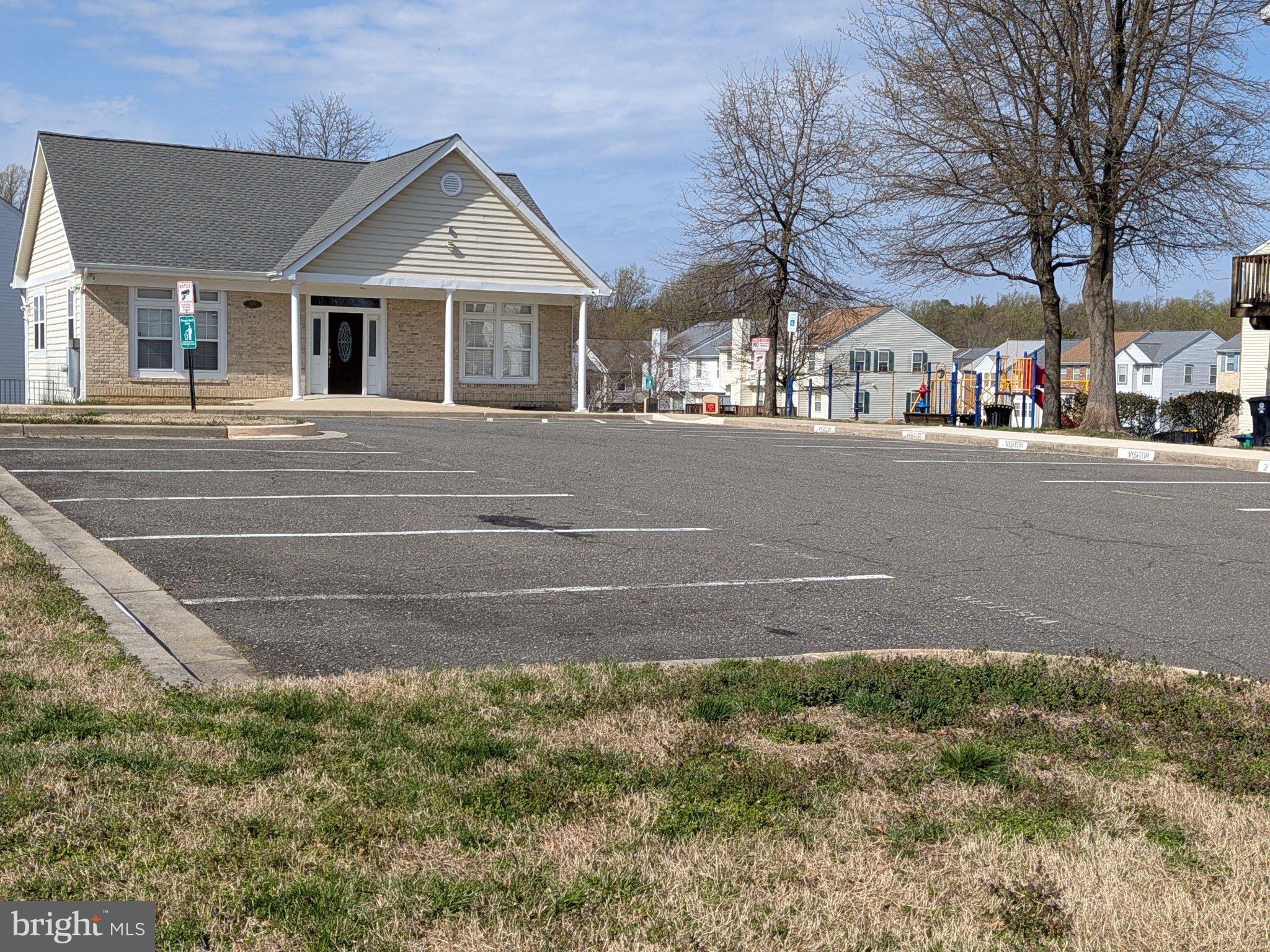 4218 Applegate Lane, Unit 9 Suitland, MD 20746 - Photo 26 of 35 a front view of a house with a yard