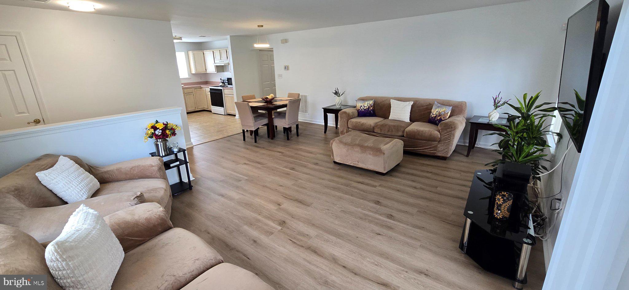 4218 Applegate Lane, Unit 9 Suitland, MD 20746 - Photo 3 of 35 a living room with furniture and wooden floor