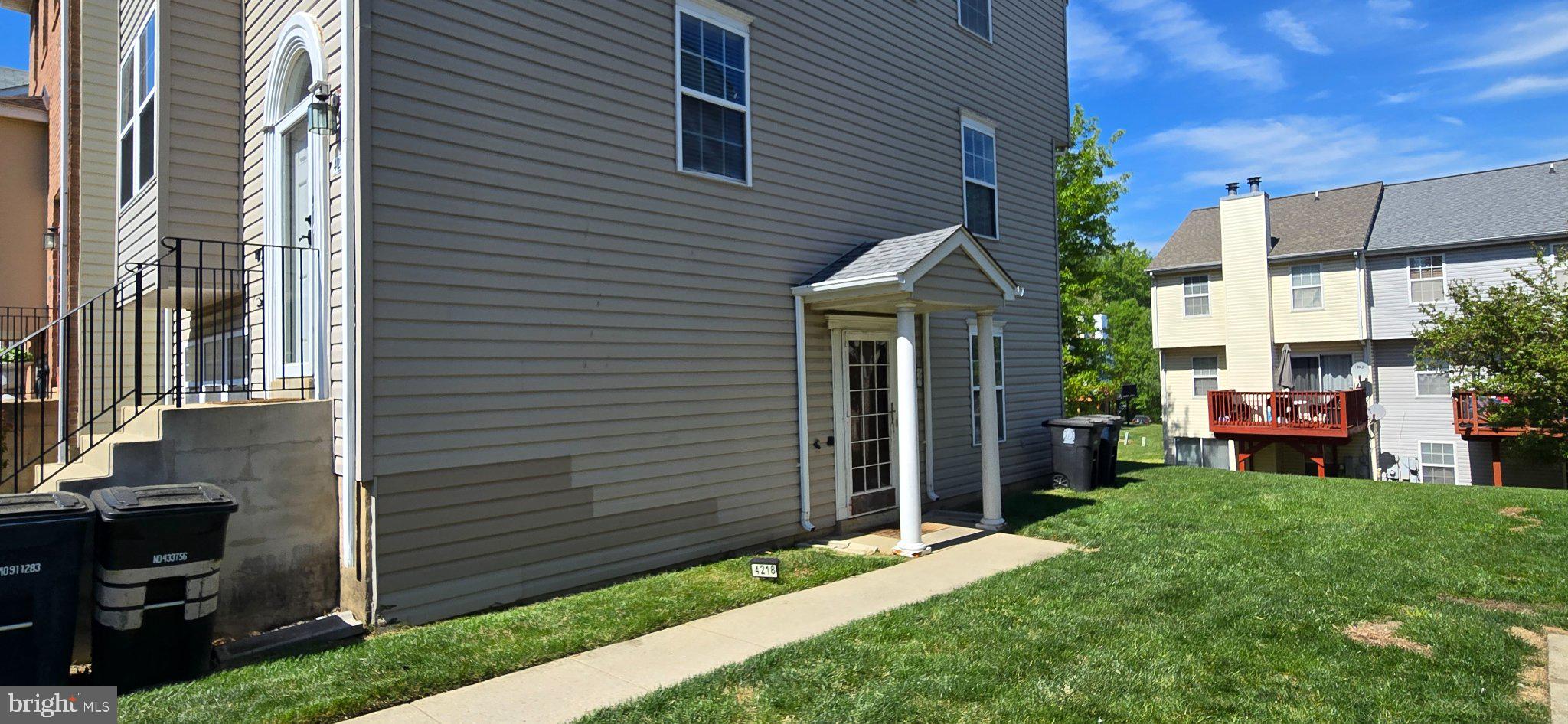 4218 Applegate Lane, Unit 9 Suitland, MD 20746 - Photo 33 of 35 a backyard of a house with table and chairs