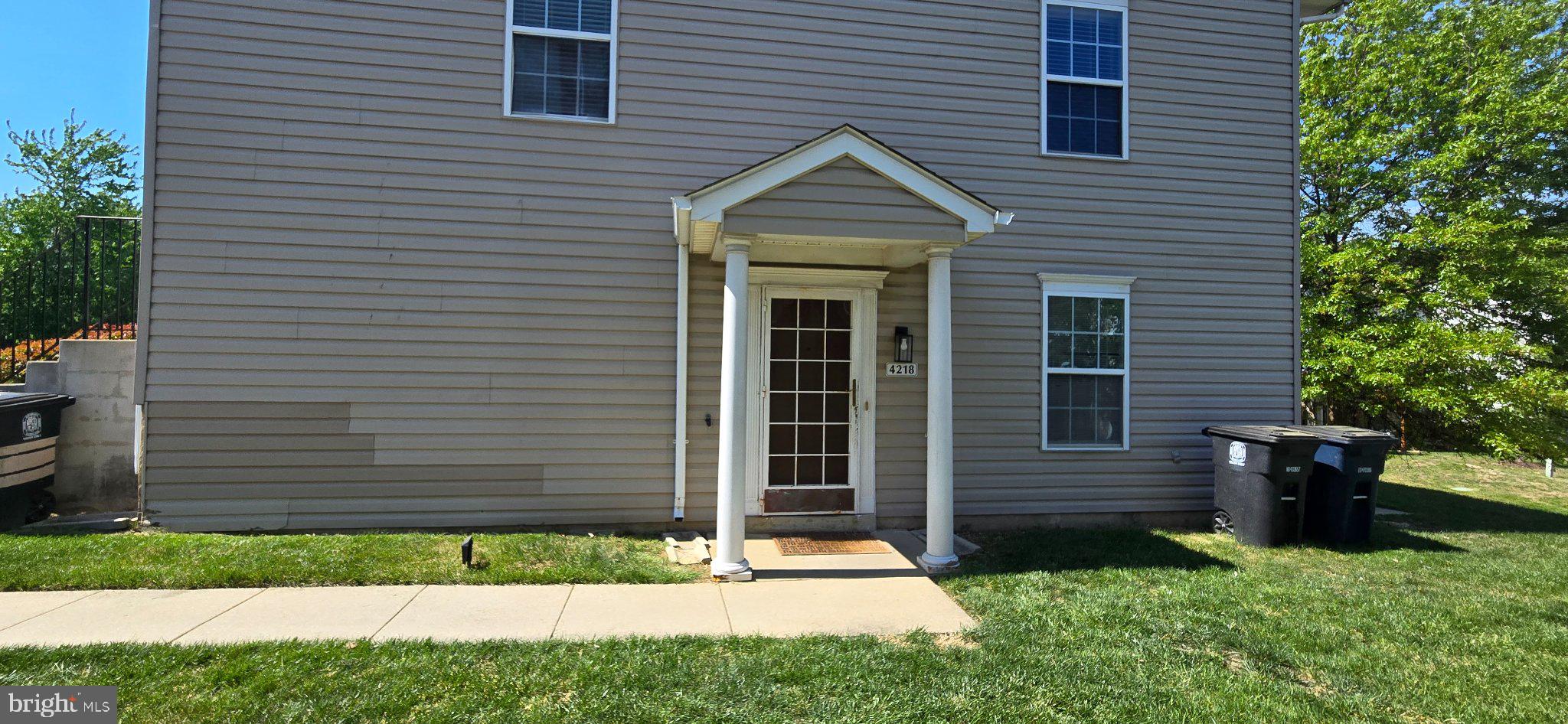 4218 Applegate Lane, Unit 9 Suitland, MD 20746 - Photo 34 of 35 a front view of a house with garden
