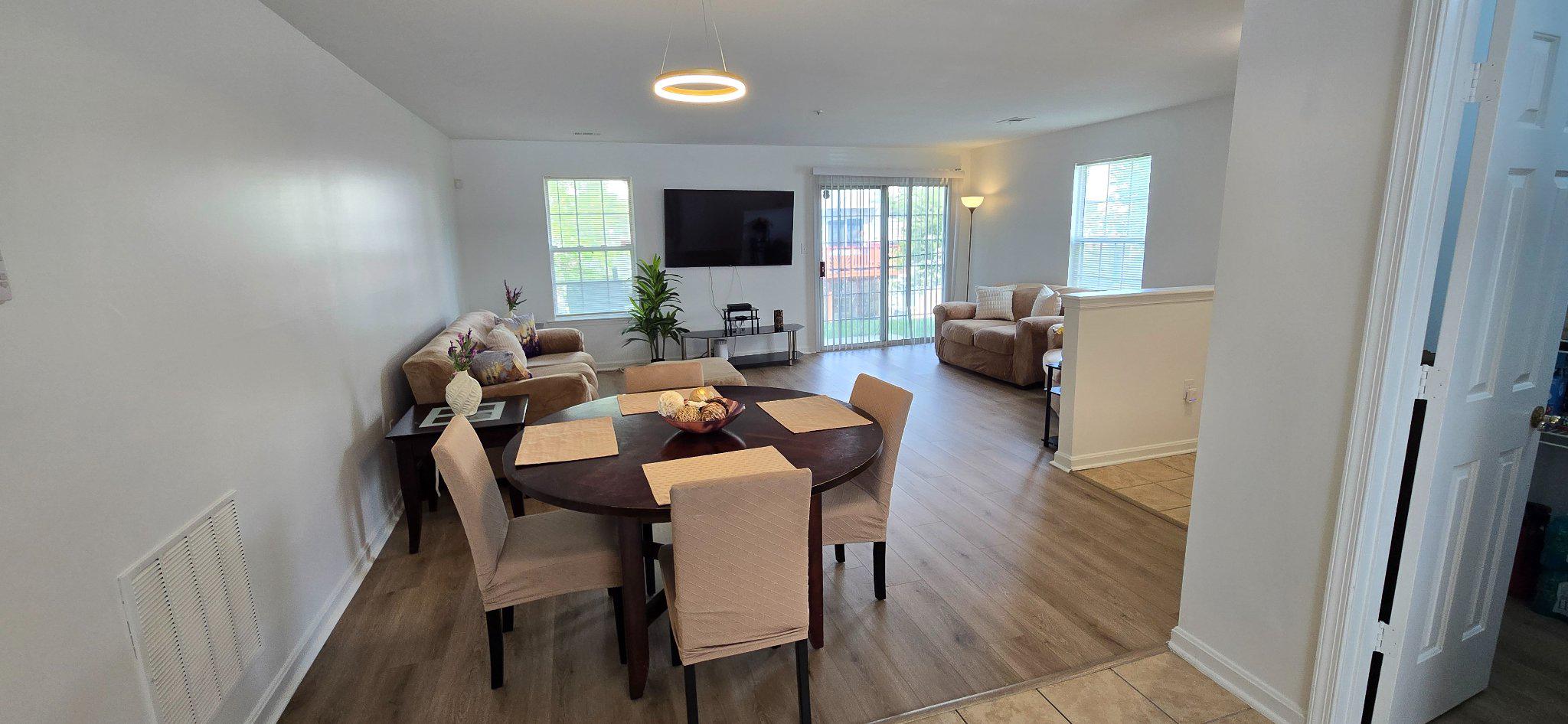 4218 Applegate Lane, Unit 9 Suitland, MD 20746 - Photo 6 of 35 a view of a dining room with furniture and wooden floor