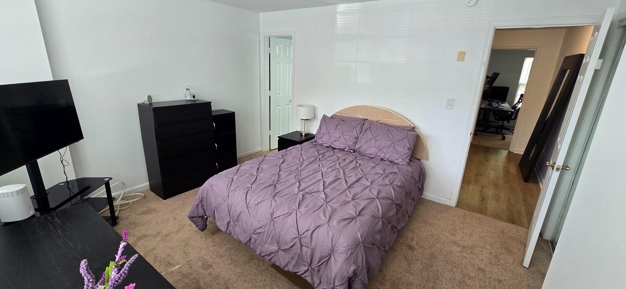 4218 Applegate Lane, Unit 9 Suitland, MD 20746 - Photo 10 of 35 a bedroom with a bed and a flat tv screen on the dresser