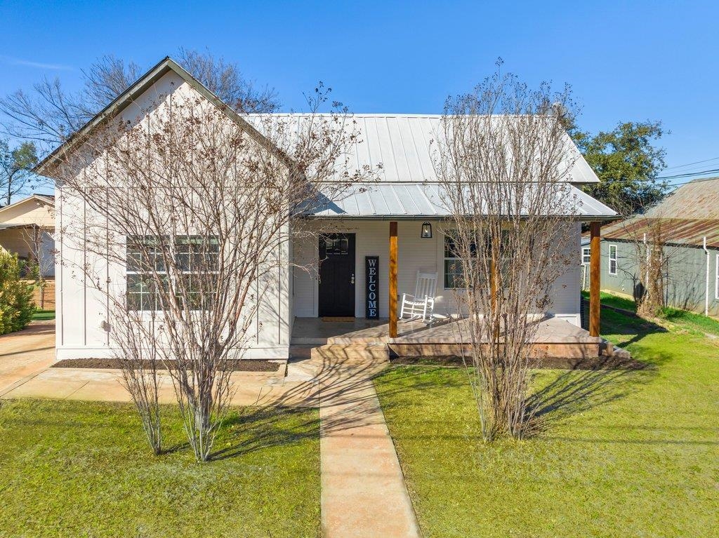 403 West Main Street Llano, TX 78643 - Photo 1 of 28 a view of a house with backyard and sitting area