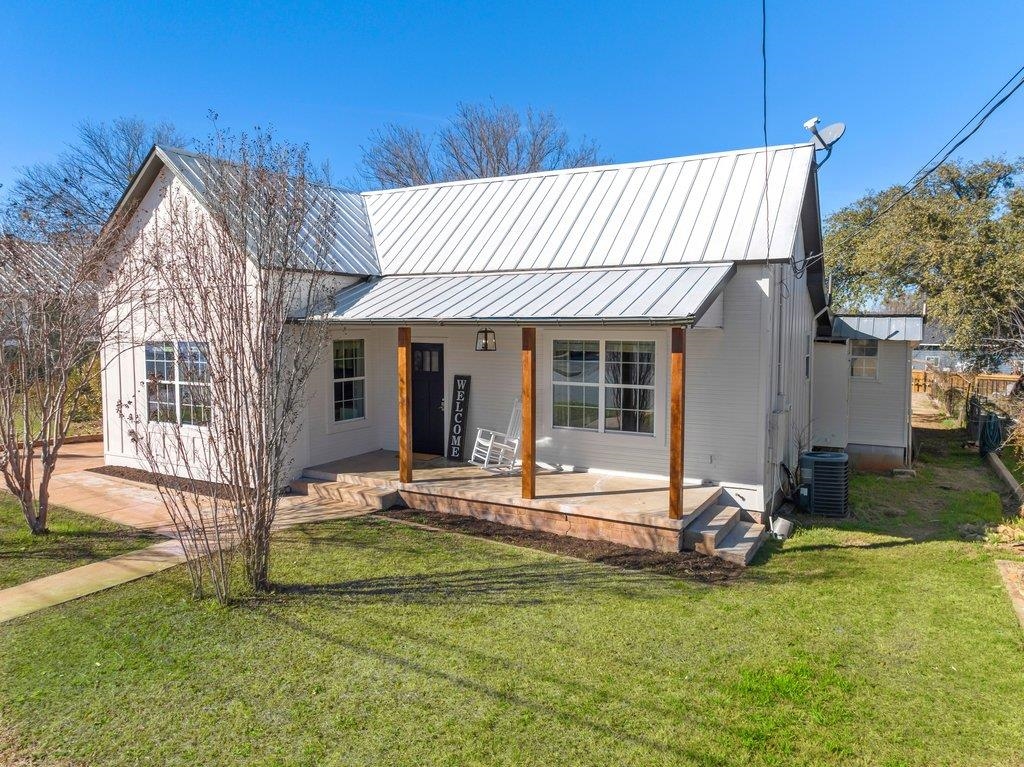 403 West Main Street Llano, TX 78643 - Photo 2 of 28 a view of a house with backyard and sitting area