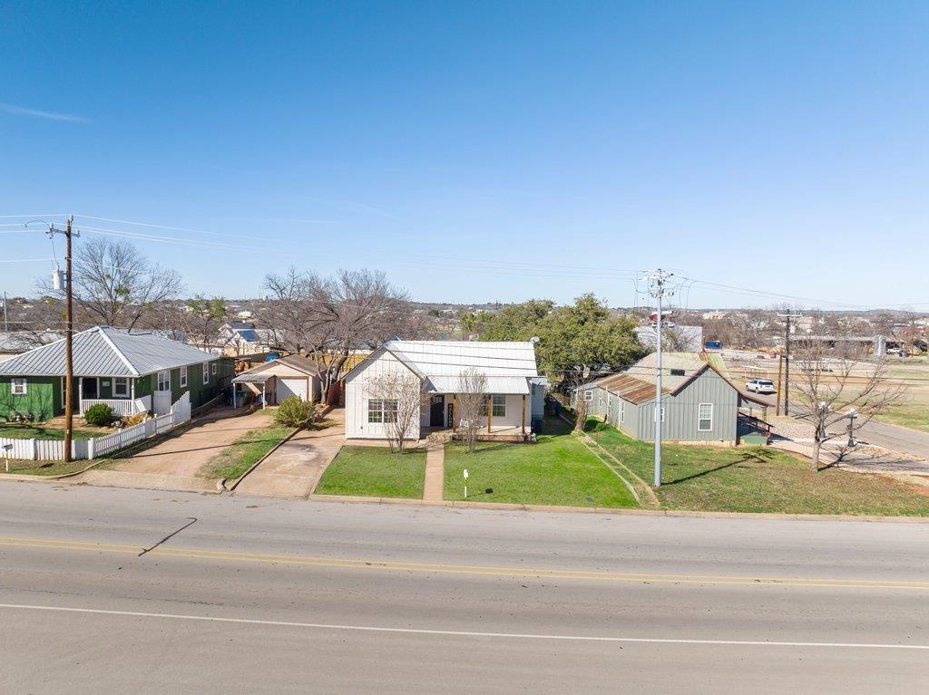 403 West Main Street Llano, TX 78643 - Photo 26 of 28 a view of a city street with tall buildings