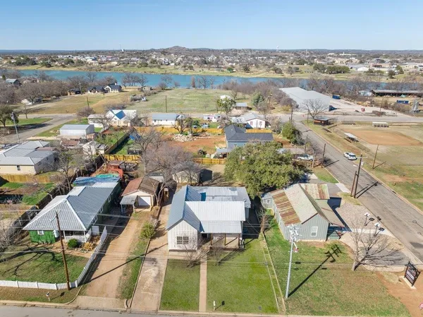 an aerial view of residential houses with outdoor space