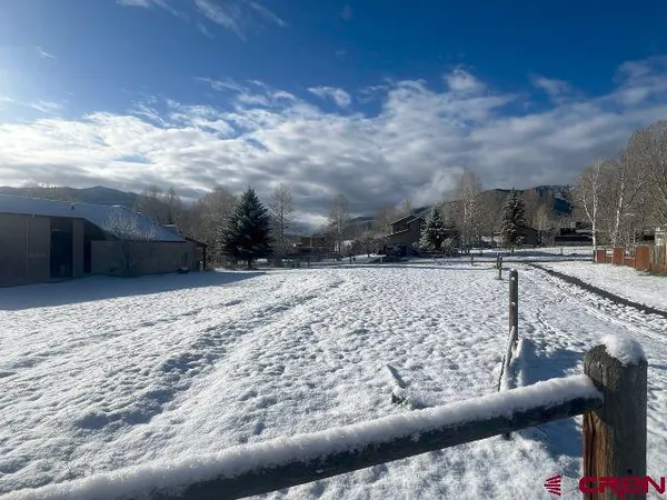 a view of roof with wooden fence