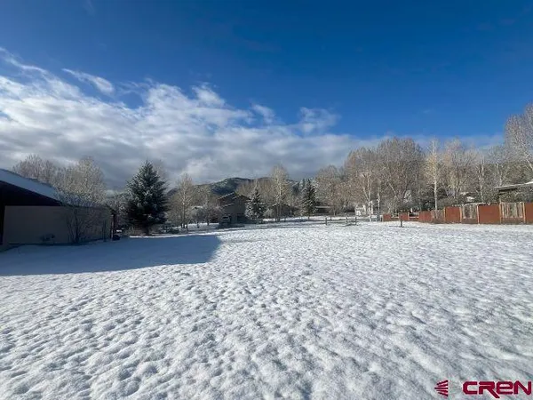 a view of roof with wooden fence