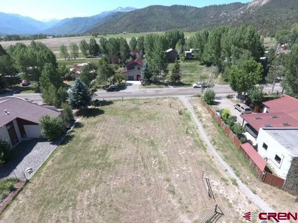 an aerial view of residential house with an outdoor space