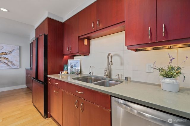 a kitchen with a sink and cabinets
