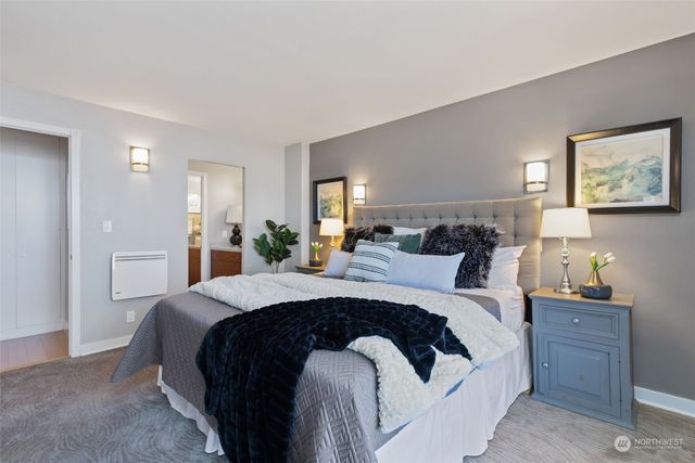 a bedroom with a bed and a view of bathroom