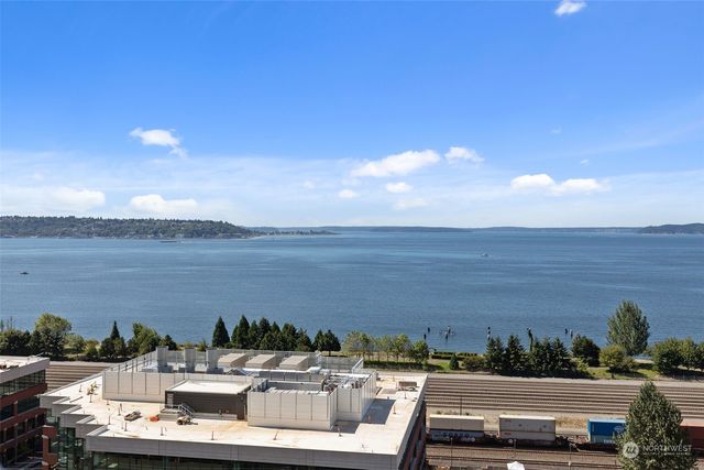 a view of a lake with furniture