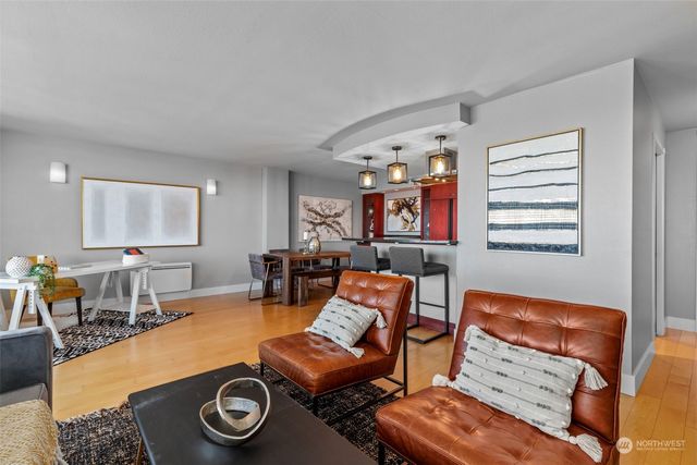 a dining room with furniture and a window
