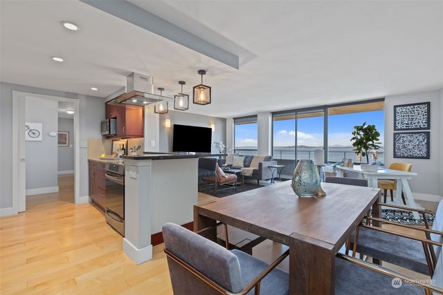 a view of kitchen and dining area with furniture