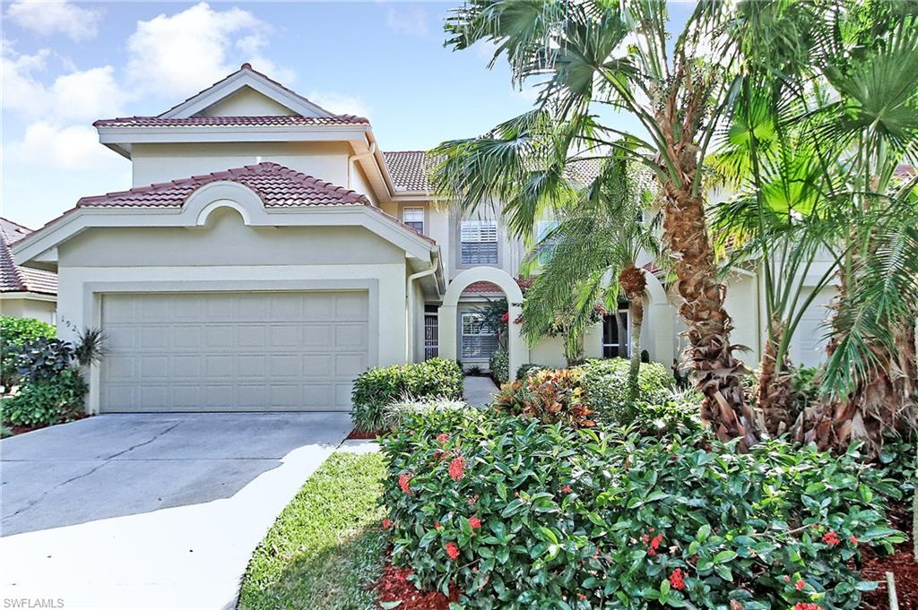 192 Napa Ridge Road East, Unit 4 Naples, FL 34119 - Photo 1 of 28 front view of a house with a yard