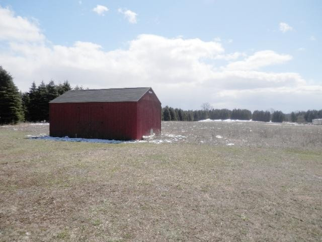9055 Potter Road Bear Lake, MI 49614 - Photo 21 of 28 Wood storage building