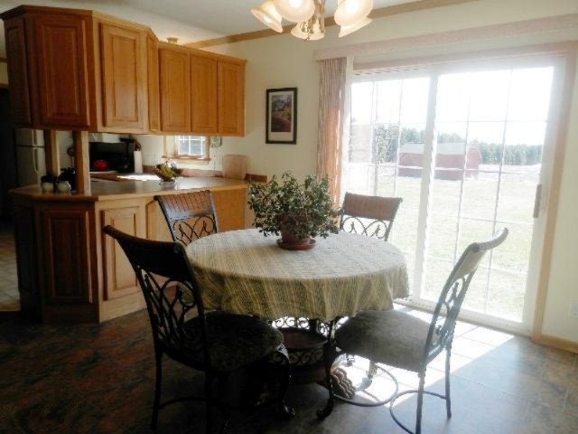 9055 Potter Road Bear Lake, MI 49614 - Photo 5 of 28 Dining area is open to kitchen