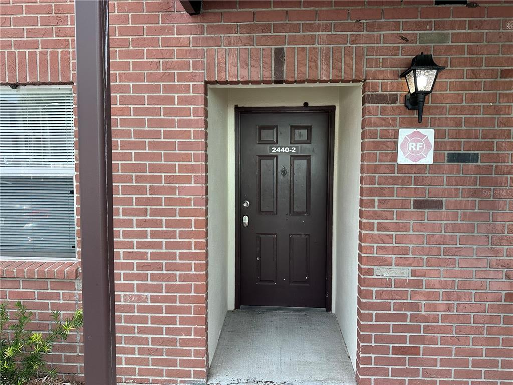 2440 Enterprise Road, Unit 2 Clearwater, FL 33763 - Photo 3 of 19 a view of wooden door