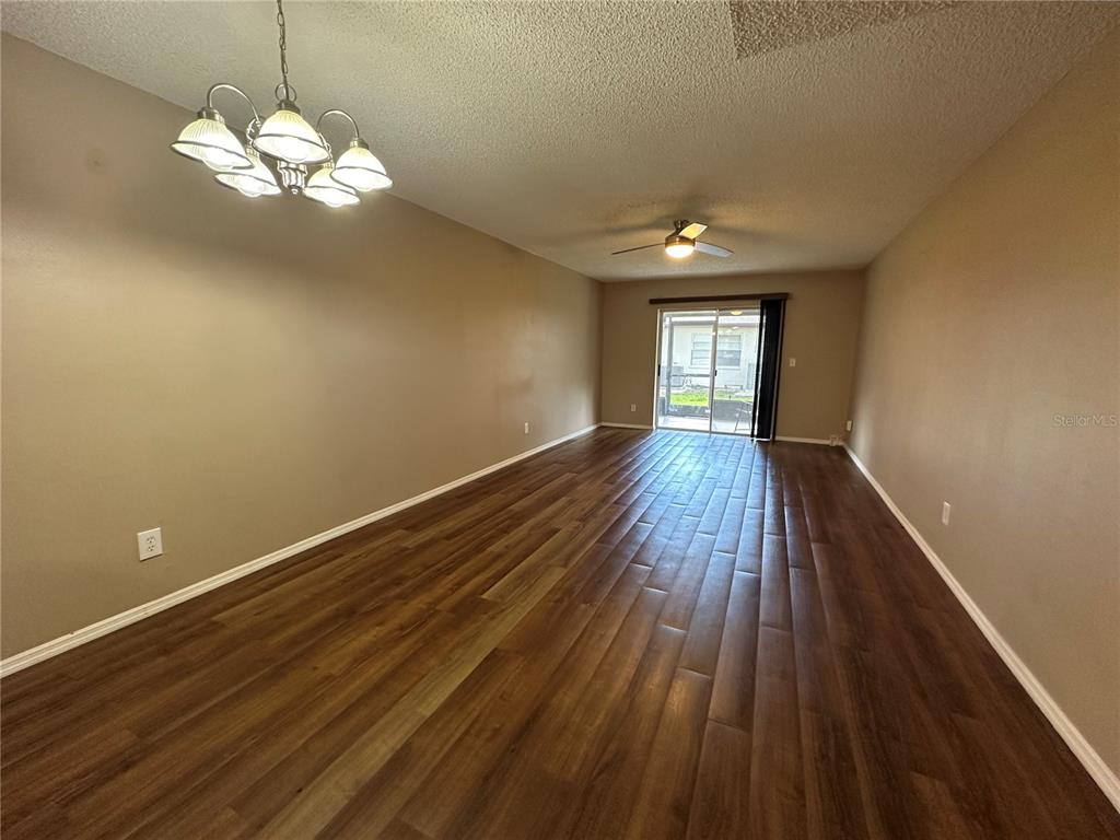 2440 Enterprise Road, Unit 2 Clearwater, FL 33763 - Photo 10 of 19 a view of a livingroom with wooden floor and a large window