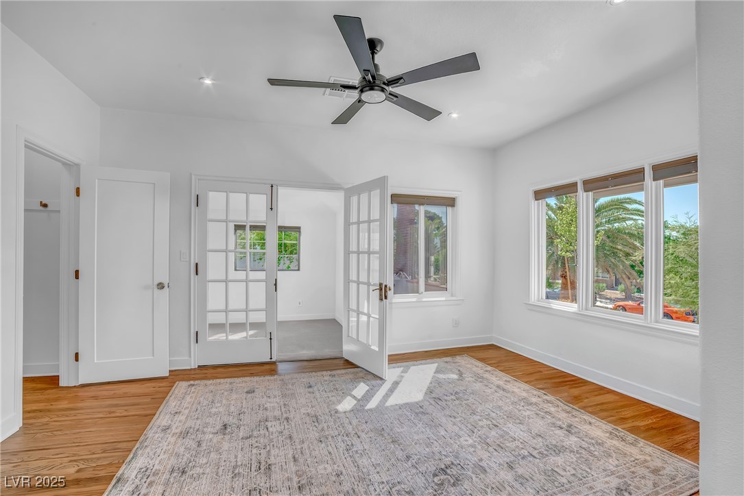1318 Denver Street Boulder City, NV 89005 - Photo 12 of 32 Flexible room with French doors, hardwood floors, recessed lighting and many natural light capturing windows. Useful as a bedroom, office, dining room, entertainment room.