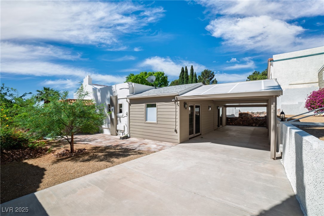 1318 Denver Street Boulder City, NV 89005 - Photo 26 of 32 View of the backyard and side yard with a covered patio