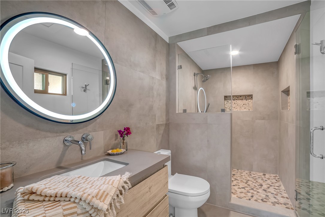 1318 Denver Street Boulder City, NV 89005 - Photo 6 of 32 Primary bathroom with glass door walk in shower and smart mirror over sink