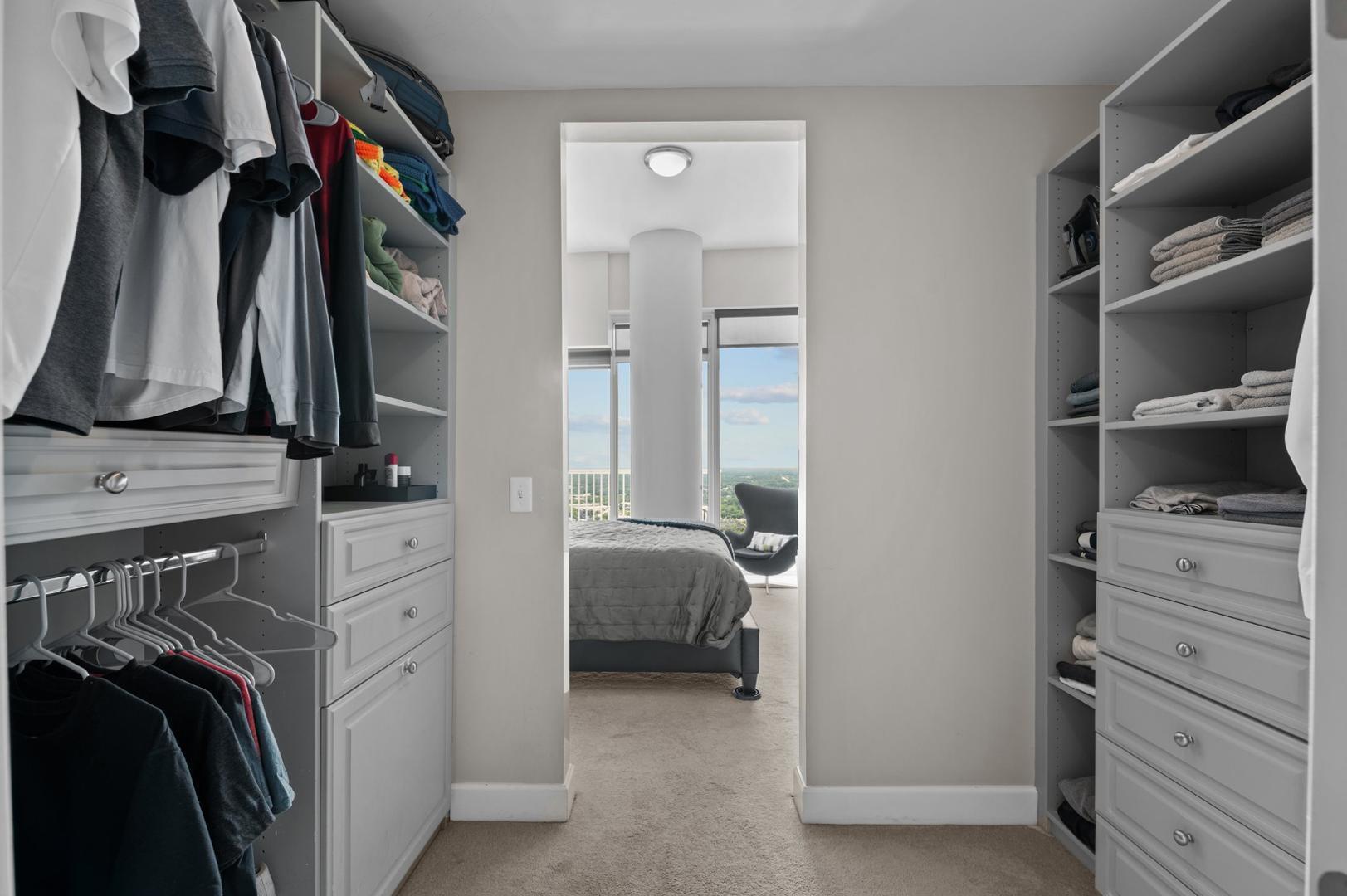 301 Fayetteville Street, Unit 33111 Raleigh, NC 27601 - Photo 21 of 64 a view of walk in closet with clothes and shoes
