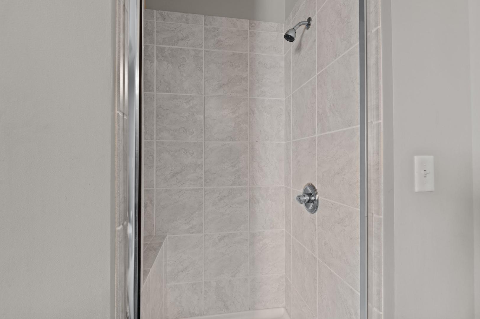 301 Fayetteville Street, Unit 33111 Raleigh, NC 27601 - Photo 24 of 64 a bathroom with a shower