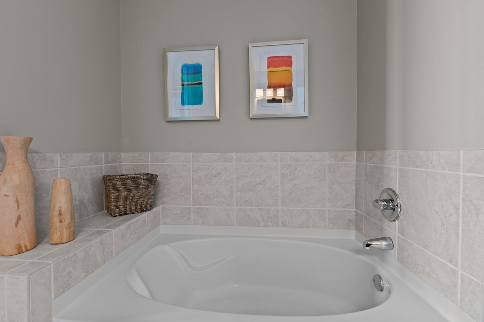 301 Fayetteville Street, Unit 33111 Raleigh, NC 27601 - Photo 25 of 64 a bath tub sitting next to a white sink