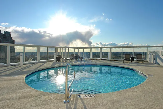 an outdoor space with furniture and umbrella
