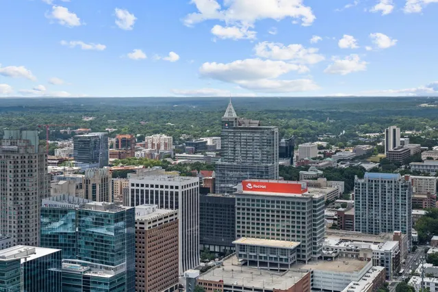 an aerial view of city and lake