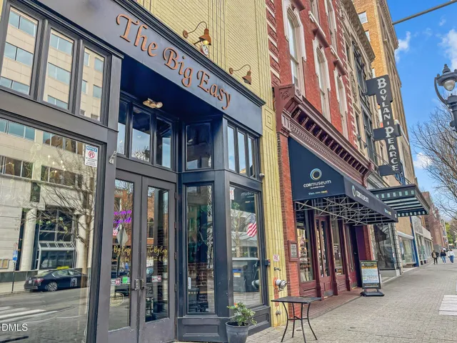 a view of a brick building with many windows