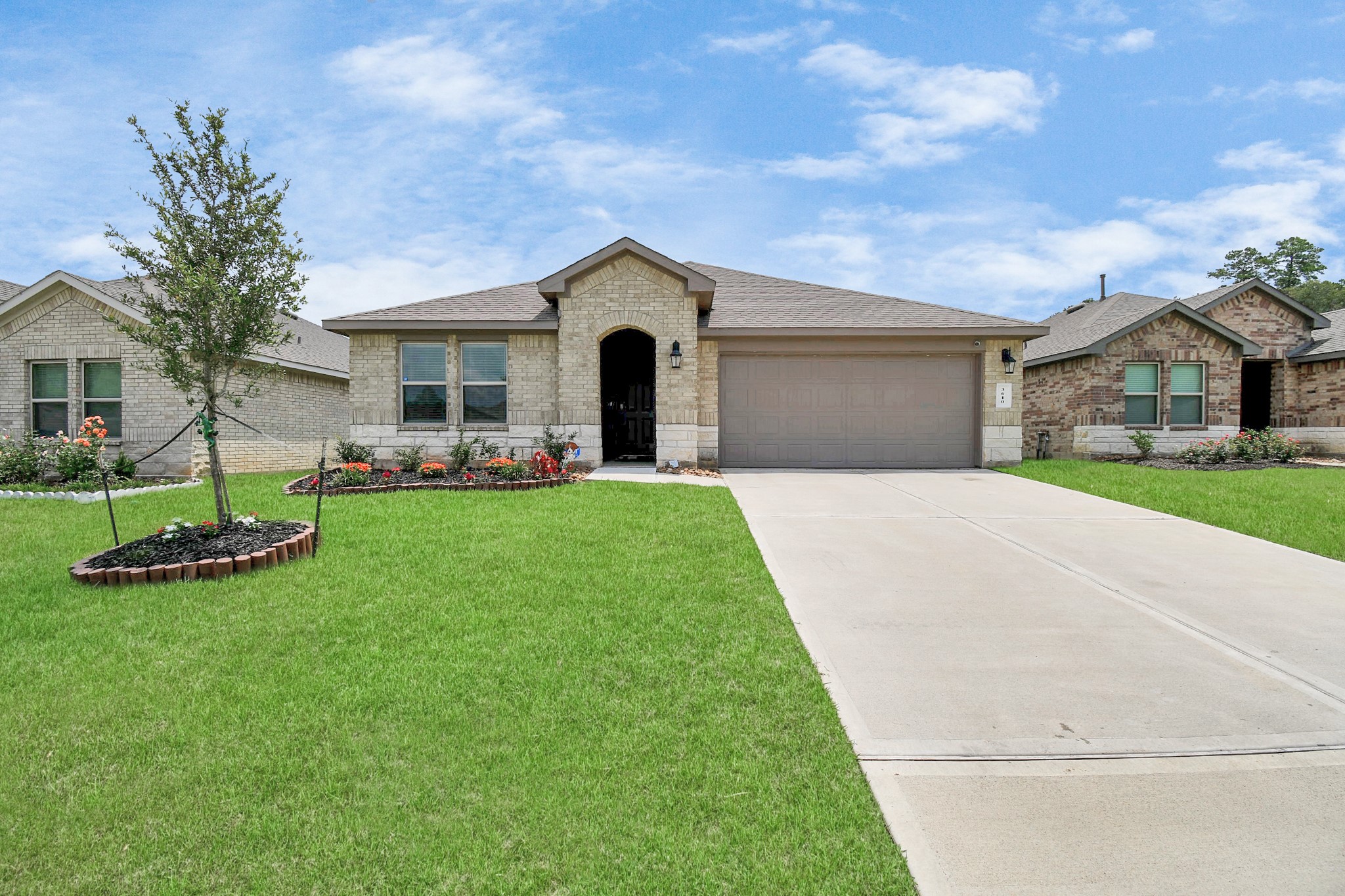 3610 Crimson Embers Lane Conroe, TX 77301 - Photo 1 of 41 a front view of house with yard and green space
